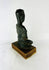 Traditional Southeast Asian seated Buddha sculpture with dhyana mudra and elongated earlobes