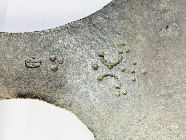 Heavy forged iron executioner’s axe from Europe, 18th century, featuring decorative guild stamp marks.
