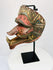 Traditional Indonesian dance mask (Cakil), late 19th century, photographed in angled profile.