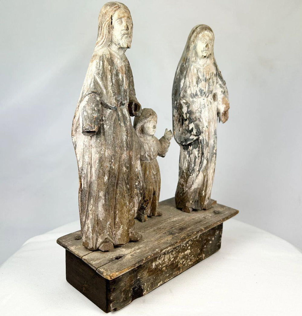 Weathered antique santo statue set with aged patina