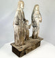 Weathered antique santo statue set with aged patina