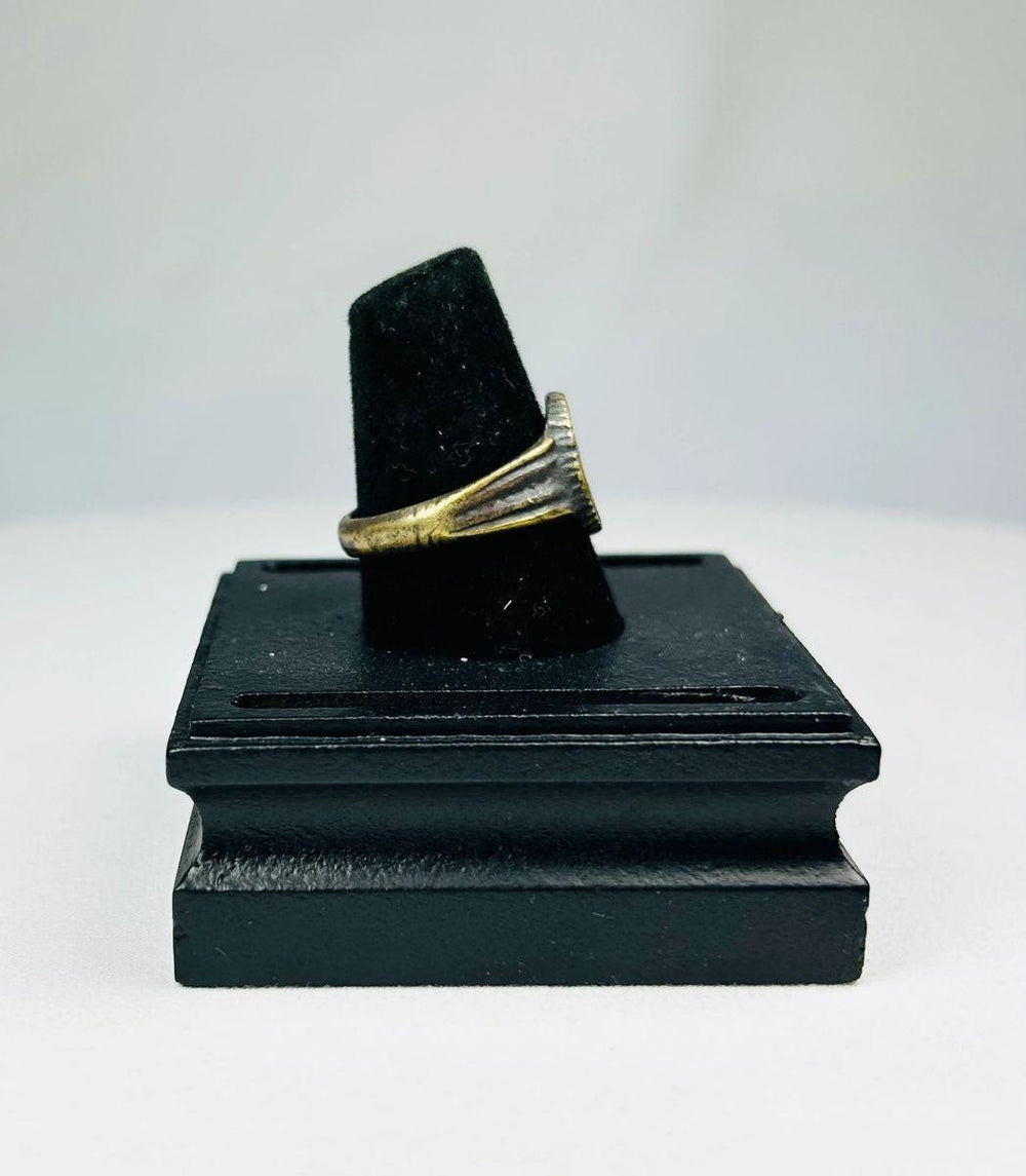 Antique Roman bronze ring with worn gold gilding and detailed floral bezel from the Near East