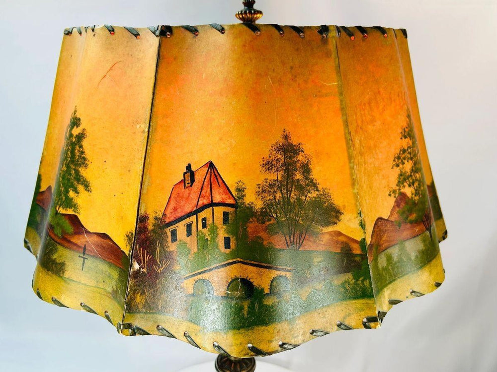 Vintage Art Nouveau lamp with countryside landscape shade, dual candle-style sockets, circa 1920s