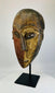 Carved wood Dan tribal mask from Côte d’Ivoire with aged finish