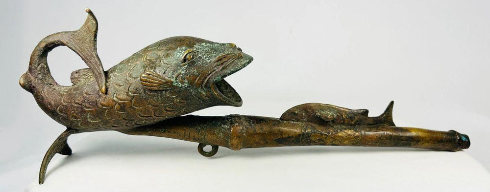 Cameroonian bronze fish pipe with curved tail and detailed scale texture