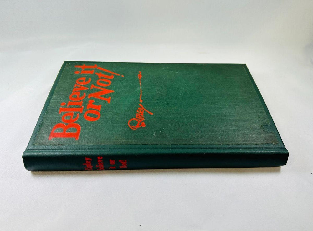 Autographed 1929 Ripley’s Believe It or Not! book, signed by Robert Ripley to A. Nathan, early printing with red title text on green cover.