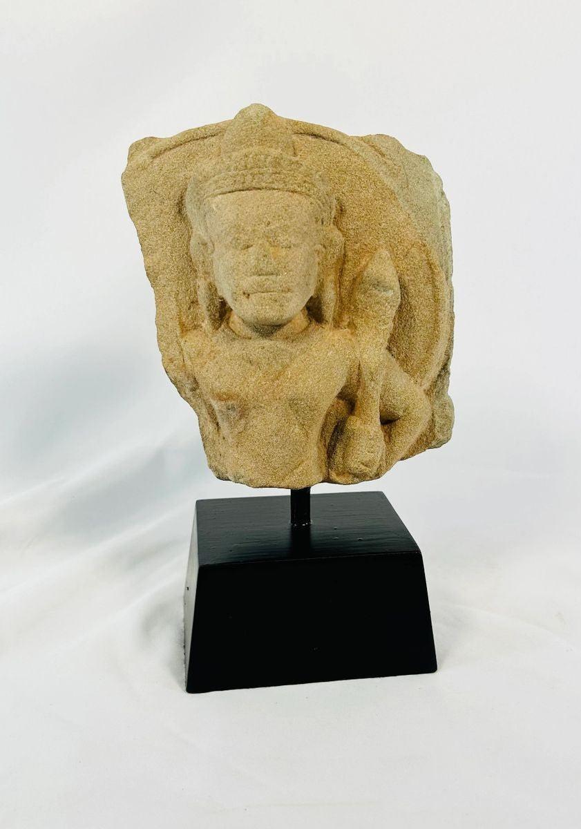 Ancient Khmer devotional sculpture fragment showing Padmapani (Avalokitesvara) in carved stone