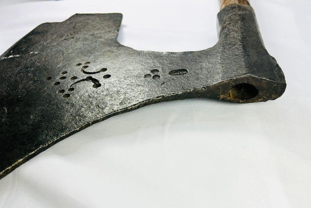Authentic 18th-century European executioner’s axe with patinated iron blade and historic guild markings.