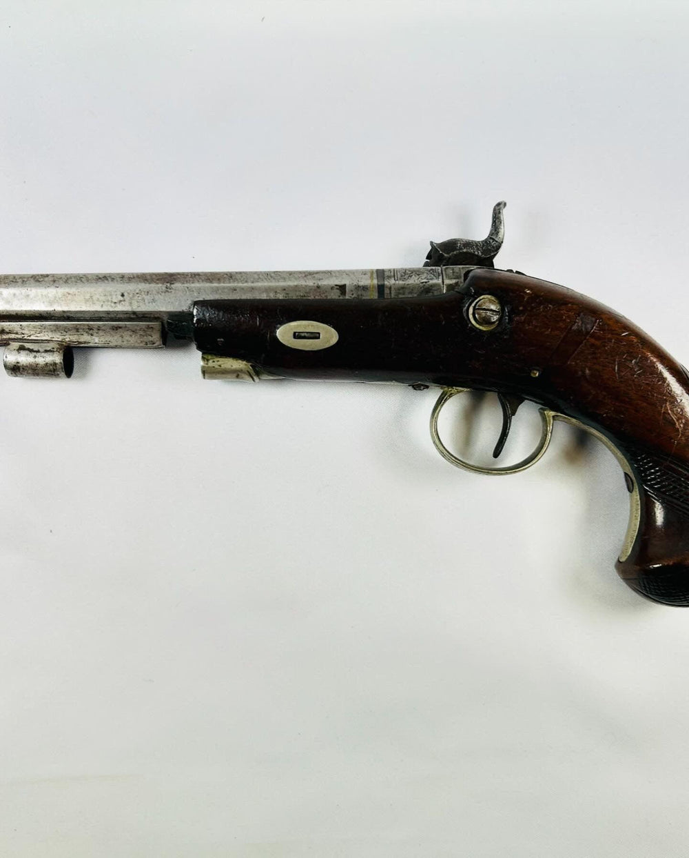 Antique Fenton London percussion pistol circa 1780–1830, full left-side view showing engraved steel barrel, trigger guard, and walnut stock on white background.