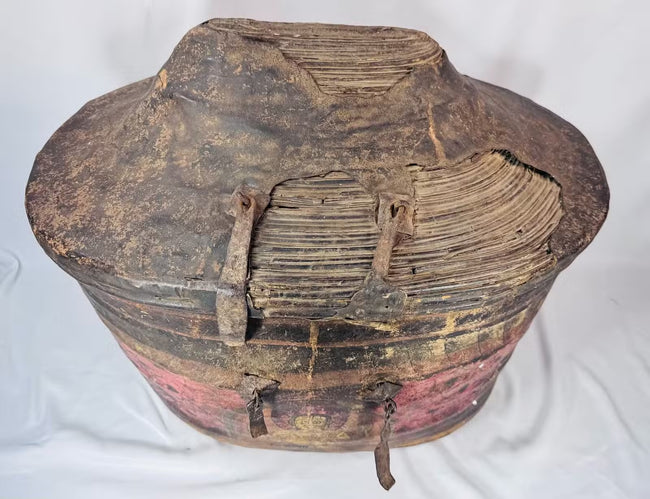 Historic surface wear and patina on painted Himalayan leather basket
