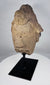 Stylized African stone face fragment with geometric features and headdress