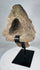 Antique African stone head fragment showing erosion, chips, and mineral accretions