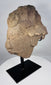Weathered West African stone head fragment mounted on a custom black stand