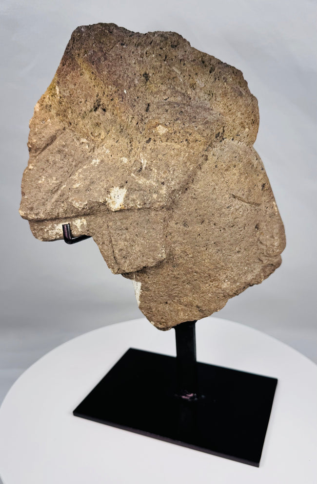 Antique African carved stone sculpture fragment with stylized human facial features