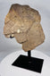 Antique African carved stone sculpture fragment with stylized human facial features
