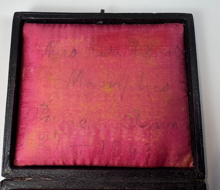 Victorian portrait of a mature woman preserved beneath a gilt brass mat