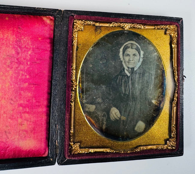 Antique photographic portrait with an embossed sailing ship presentation case