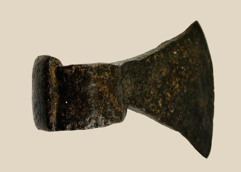 19th-century American forged iron axe head with wide blade, robust socket, and rich aged patina, used for timber work and settlement life.