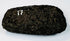 Ancient South American stone axe showing its rounded, resharpened cutting edge and compact hand-worked form.