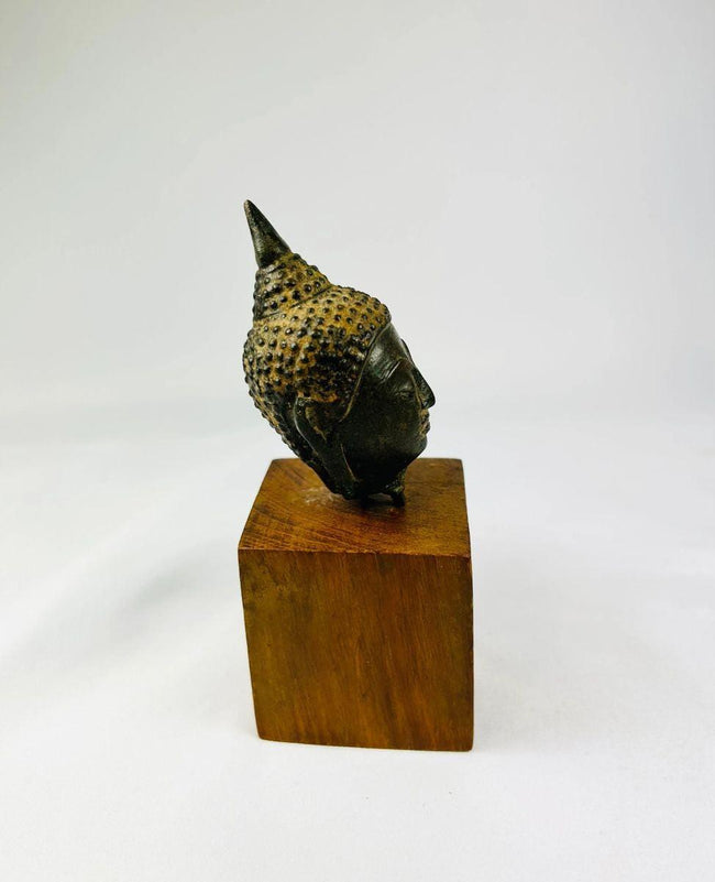 Antique Thai Buddhist bronze Buddha head with sculpted curls and traditional ushnisha