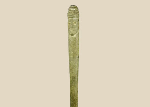 Ancient Bactrian dual-faced whetstone, 2nd millennium BCE, carved from chlorite or steatite with symmetrical features and natural patina.