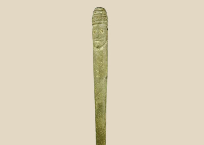 Ancient Bactrian dual-faced whetstone, 2nd millennium BCE, carved from chlorite or steatite with symmetrical features and natural patina.