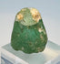 Iron Age glass seal with pale deposits, iridescence, and worn engraved design