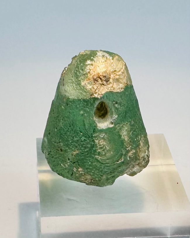 Iron Age glass stamp seal with domed body and transverse suspension hole