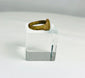 Side view of an ancient bronze ring highlighting thickness and worn surface from centuries of use