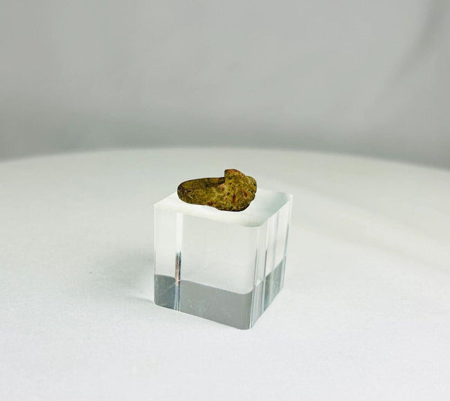 Profile view of a bronze ring from antiquity illustrating form and craftsmanship
