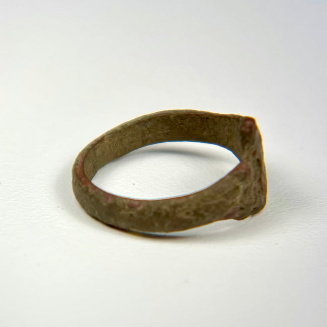 Historic bronze finger ring with substantial band, simple bezel, and archaeological patina