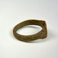 Historic bronze finger ring with substantial band, simple bezel, and archaeological patina