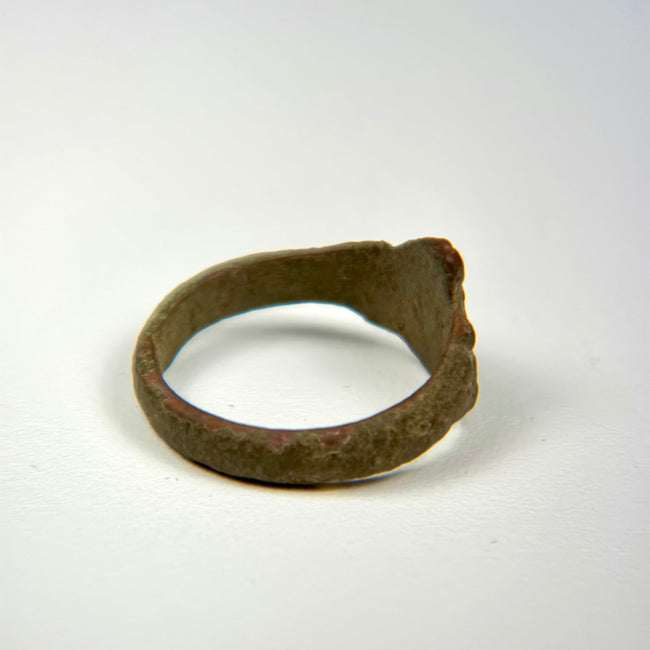 Ancient Middle Eastern bronze ring showing centuries of wear, oxidation, and surface weathering