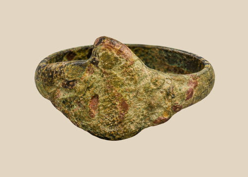 Ancient bronze ring from the Mediterranean or Middle East, 1st–5th century CE, with a bold bezel, natural patina, and simple, elegant design.