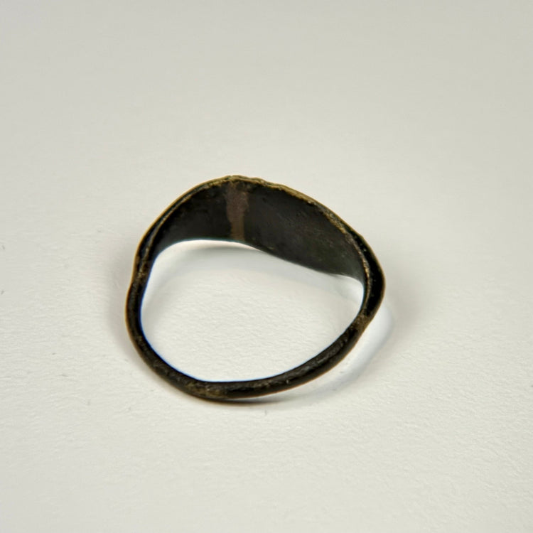 Roman-period style bronze ring with oval engraved bezel and naturally aged green patina