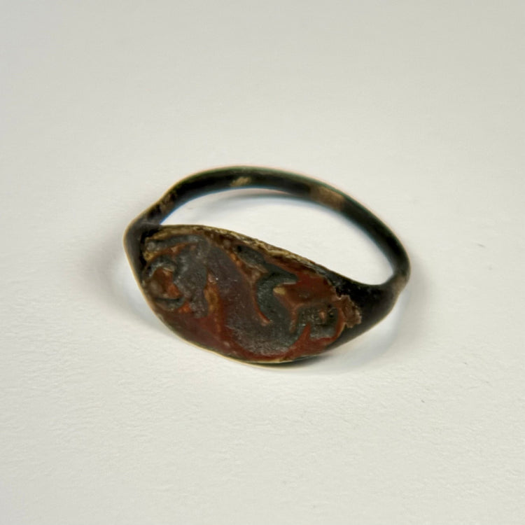 Ancient Near Eastern bronze ring with oval bezel depicting a horned animal symbol of strength