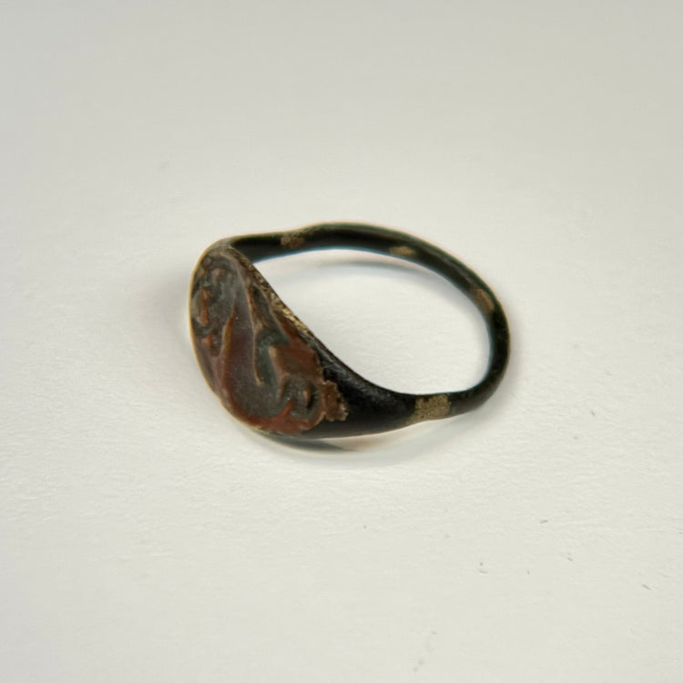 Early centuries CE bronze ring with finely incised bull engraving and weathered archaeological surface