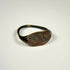 Mediterranean bronze finger ring featuring an engraved bull motif and natural green patina