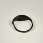 Ancient bronze finger ring featuring a symbolic bull associated with strength, fertility, and power