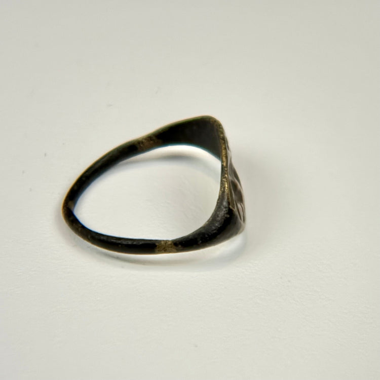 Bronze ring from the 1st–4th century CE with preserved oval bezel and engraved bull imagery