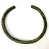 Ancient bronze bangle showing textured green oxidation and age-related surface wear from the 1st to 3rd century AD