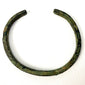 Ancient bronze bangle showing textured green oxidation and age-related surface wear from the 1st to 3rd century AD