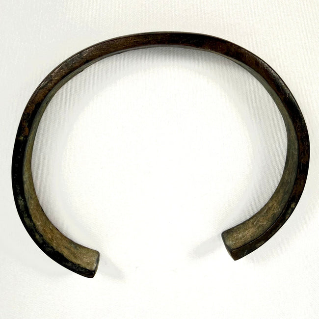 Ancient iron bangle from the 1st to 3rd century AD showing aged oxidation and preserved open-ended form