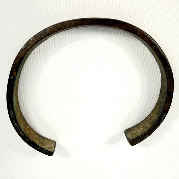 Ancient iron bangle from the 1st to 3rd century AD showing aged oxidation and preserved open-ended form
