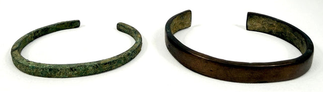 Pair of ancient bronze and iron open cuff bracelets from the 1st to 3rd century AD shown together