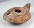 Byzantine terracotta lamp with central filling hole, wick opening, and solid handle
