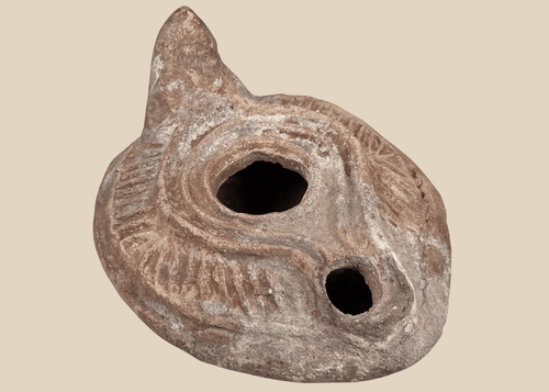 Late Roman to Early Byzantine terracotta oil lamp with radiating shoulder decoration