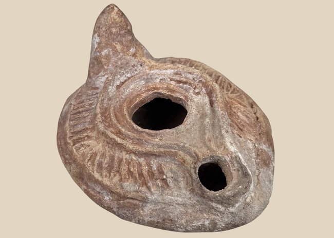Late Roman to Early Byzantine terracotta oil lamp with radiating shoulder decoration
