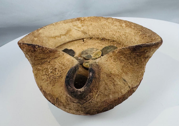 Terracotta saucer-shaped oil lamp from ancient Carthage accompanied by bronze coins and archaeological patina
