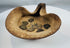 Historic Carthaginian oil lamp featuring folded rim design and group of bronze coins